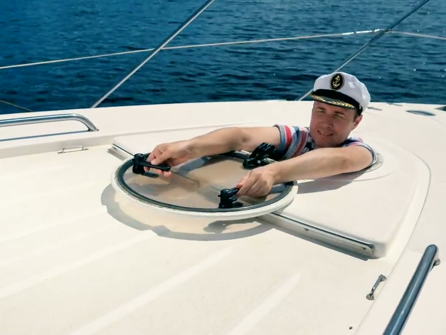 An open deck hatch aboard a yacht under refit